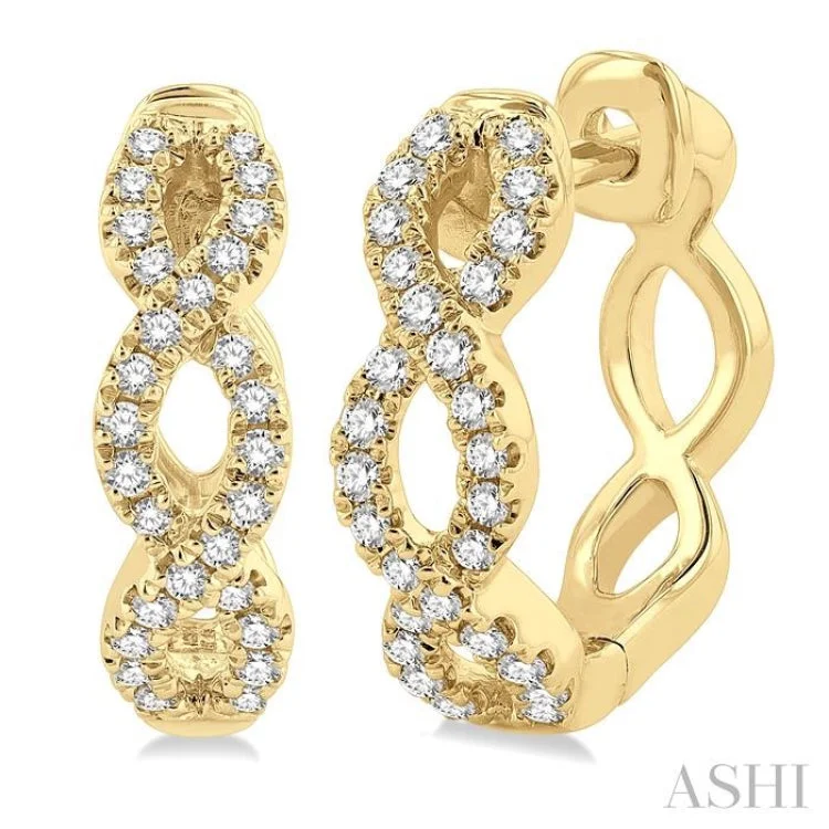 Stylish Drop Earrings for Casual Wear-1/4 ctw Petite Twisted Round Cut Diamond Fashion Huggies in 10K Yellow Gold